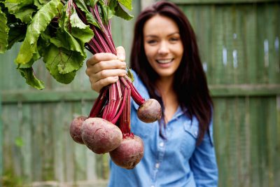 Lady holding beets - Anemia 5 Awesome Natural Remedies to Boost Your Iron Levels